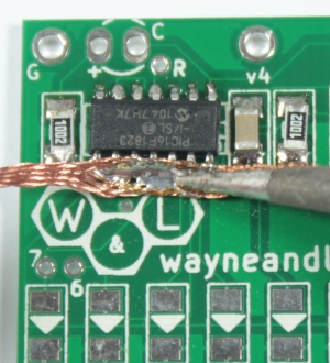 Use solder wick to remove large blobs and bridges