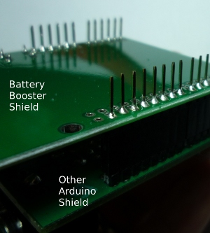 Solder long header pins into shield