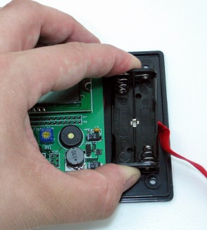 Press the battery holder into place next to the PCB