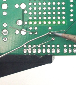 Solder leads onto circuit board